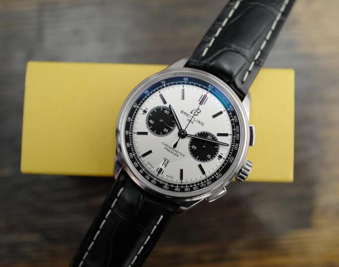 The two black chronograph dials are striking to the white background.