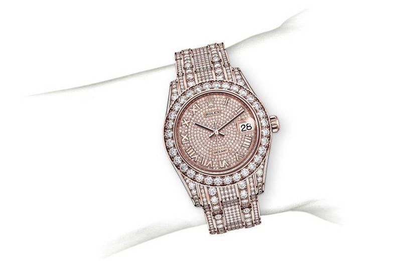 The 18ct everose gold fake watches are paved with diamonds.